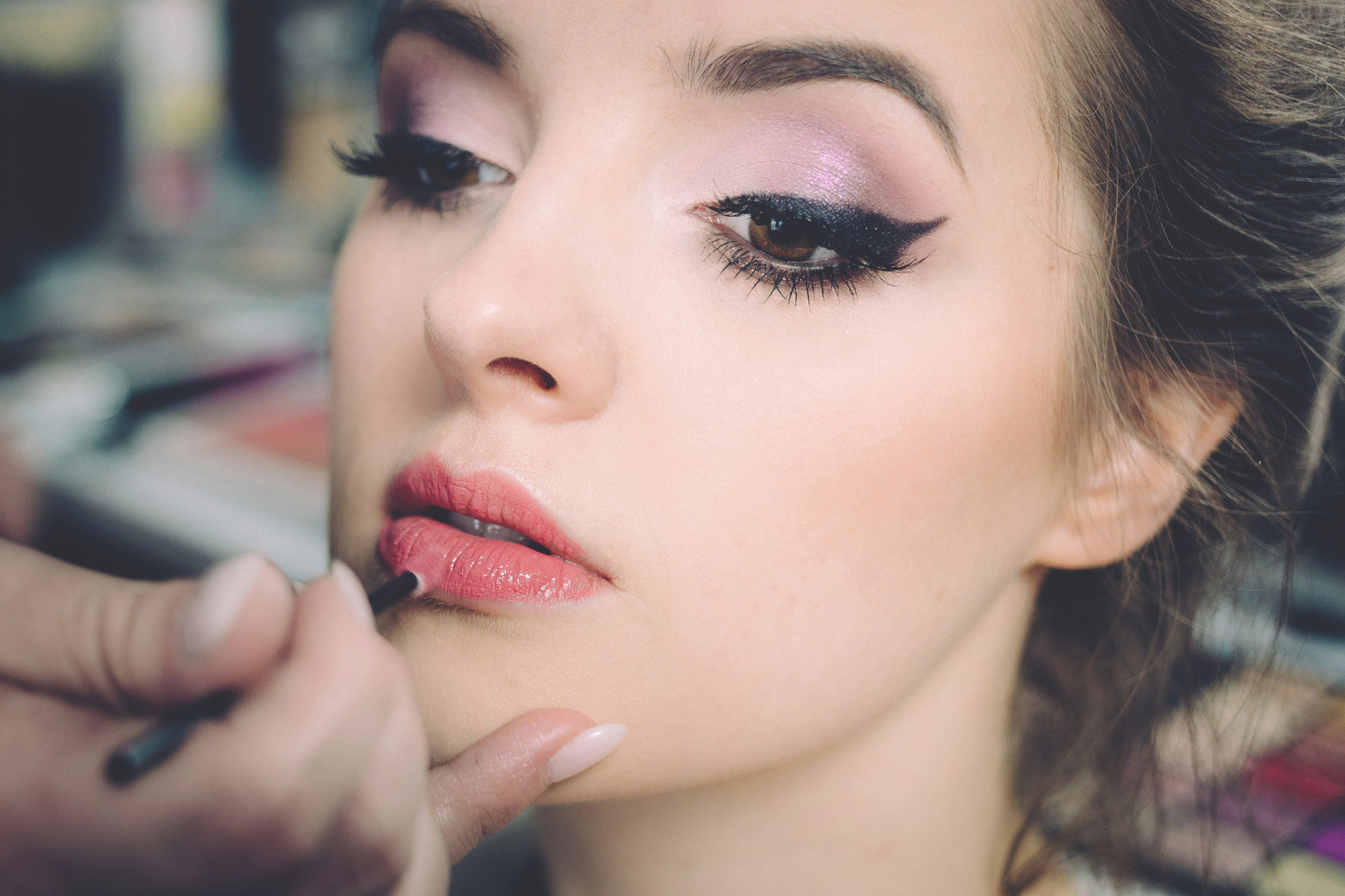 Applying lipstick